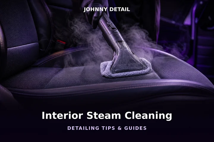 Steam cleaner extracting stains from a car seat under purple studio lighting — Johnny Detail interior steam cleaning guide