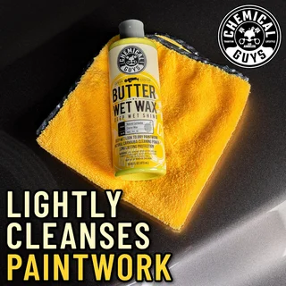 Chemical Guys Butter Wet Wax bottle on yellow cloth with "Lightly Cleanses Paintwork" text