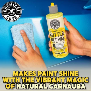 Hands holding sponge and Butter Wet Wax bottle over blue car hood, with bold text overlay