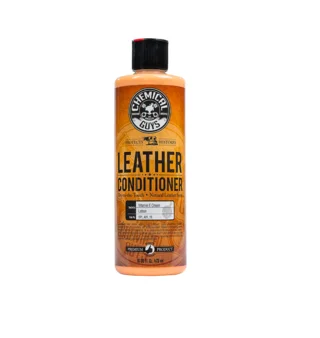 Orange bottle of leather conditioner with a black cap on a white background