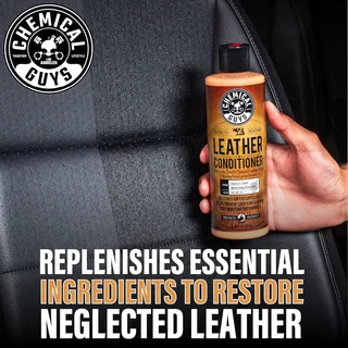 Hand holding leather conditioner bottle against car seat; ad text about restoring leather