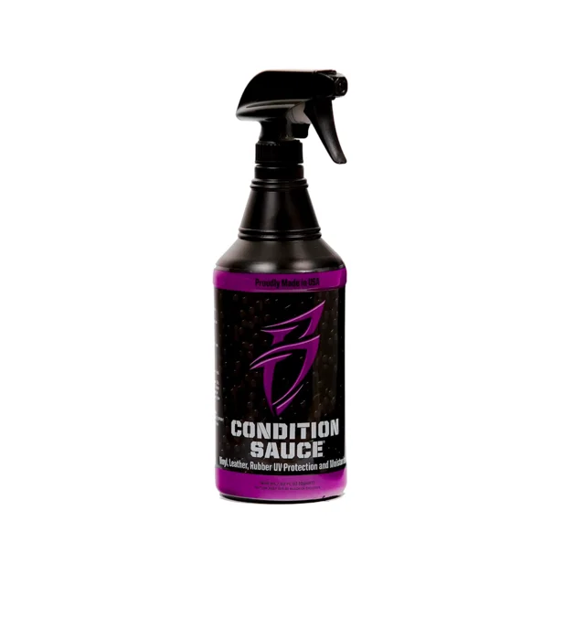 Black spray bottle of Condition Sauce with purple label on white background