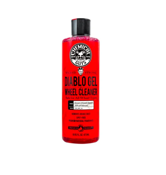 Red bottle of Atomic Ruby Red facial cleanser with black cap on white background