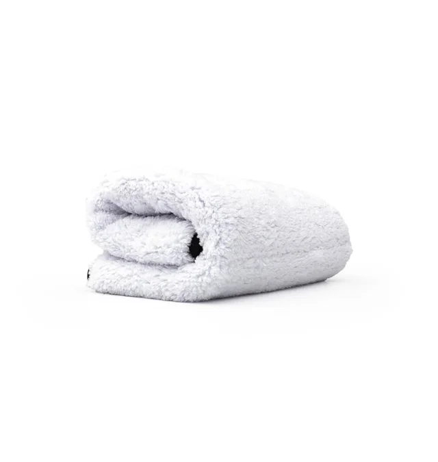 Folded white bath towel on a white background