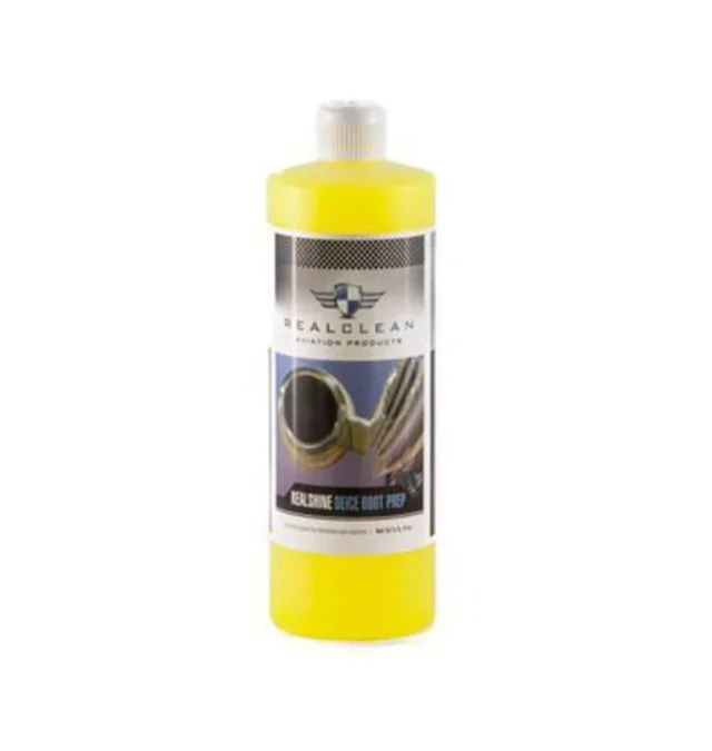 Yellow bottle of car polish with black and silver label on white background