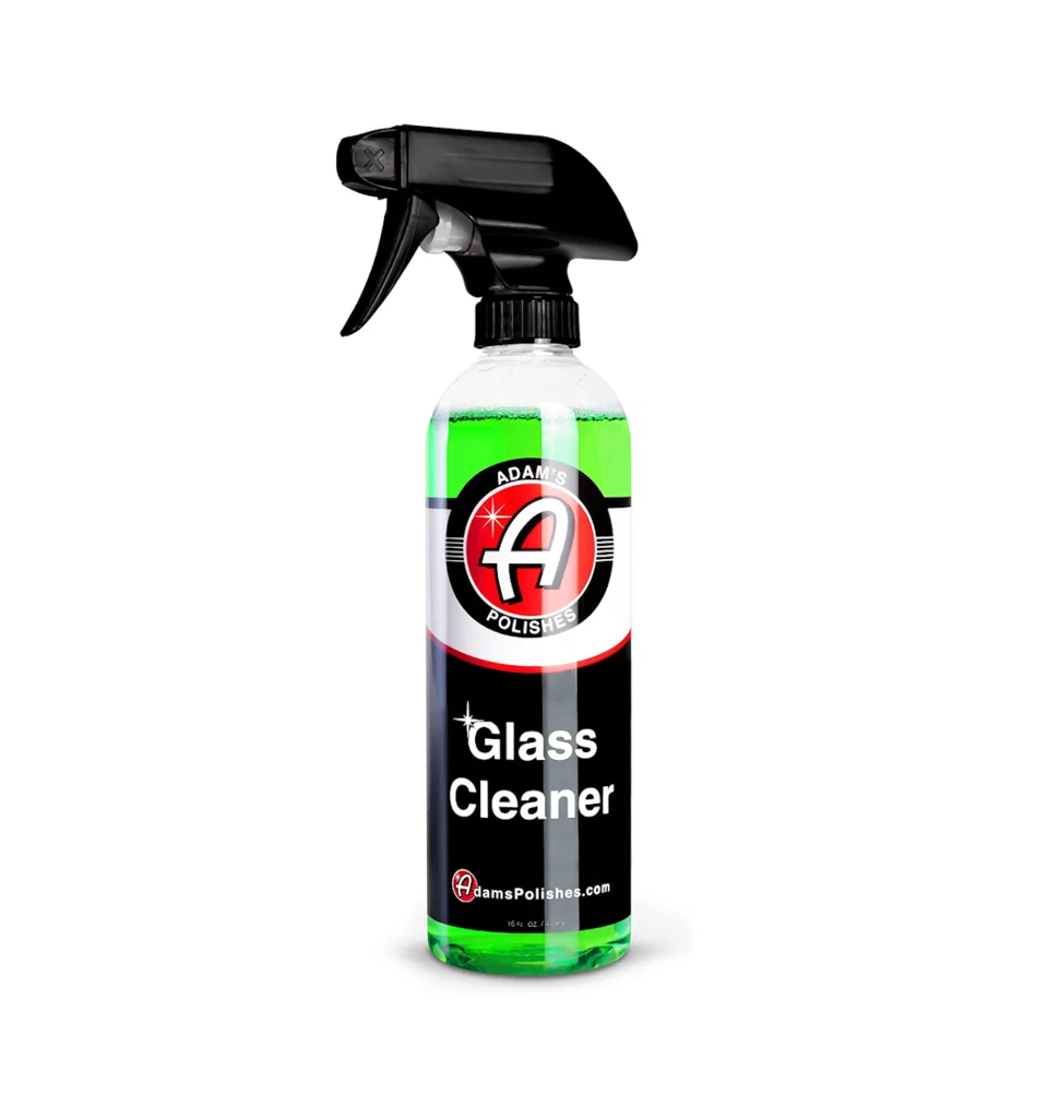 Spray bottle of glass cleaner with black nozzle and green label
