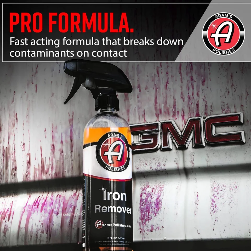 Pro Formula Iron Remover spray bottle in front of a stained GMC truck tailgate
