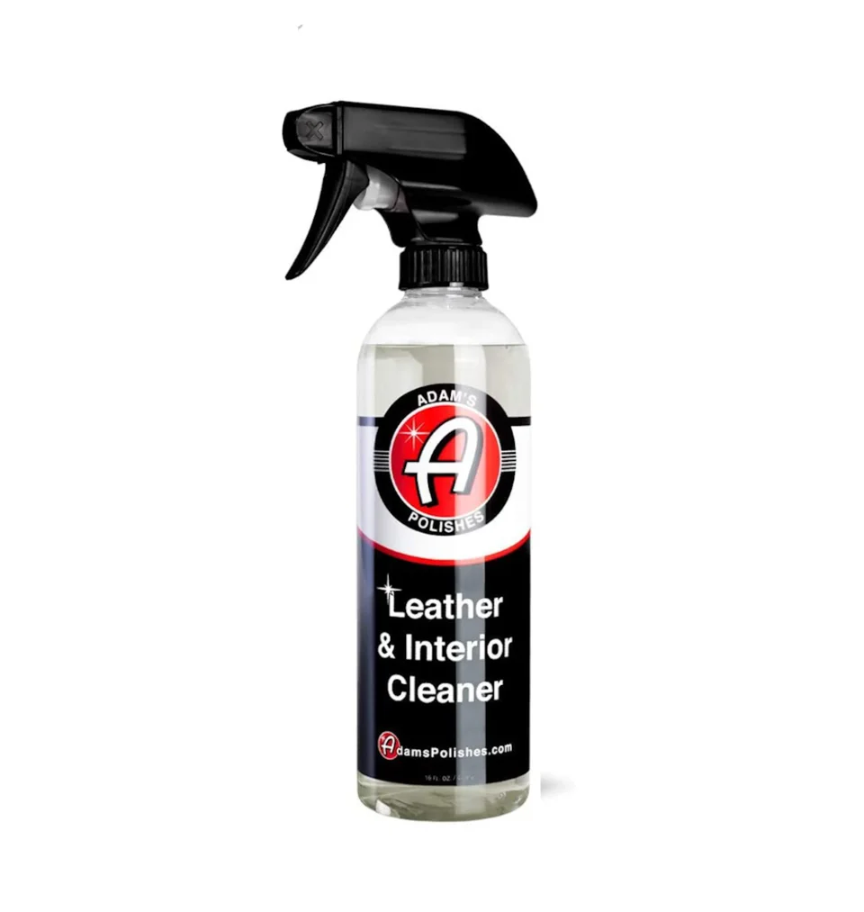 Bottle of leather and interior cleaner with black spray nozzle, on white background