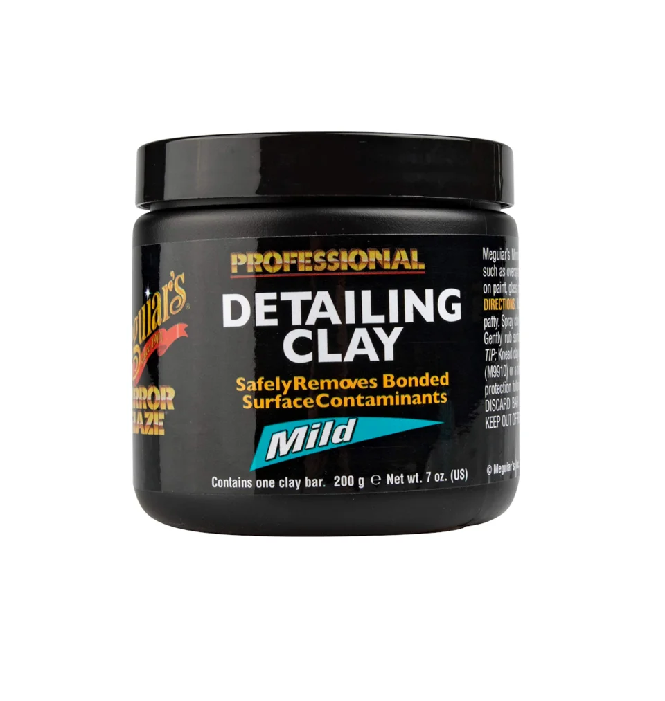 Black jar of professional detailing clay with multicolor label on white background